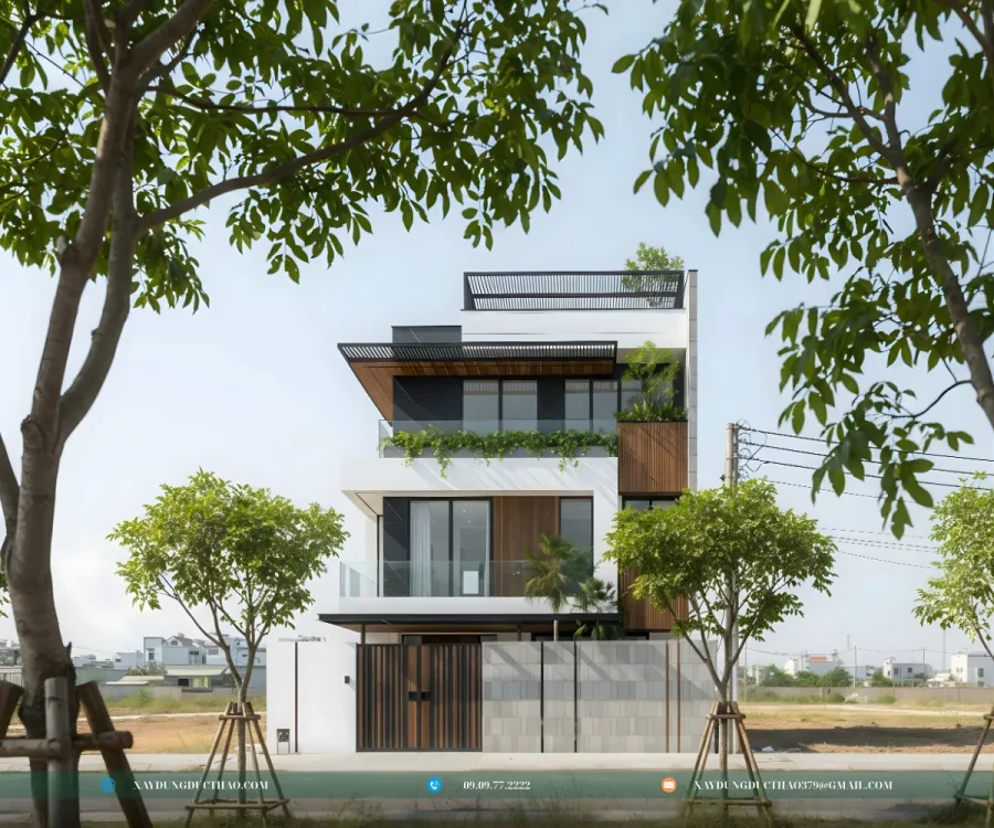 Hoàn thiện ngoại thất biệt thự 3 tầng hiện đại với ban công rộng và lan can kính.